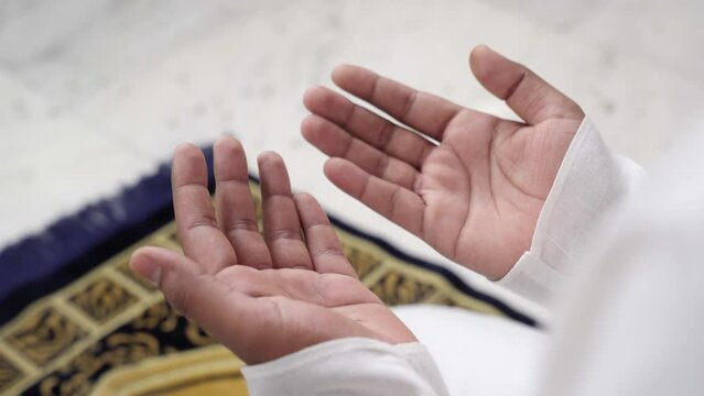 Close Up shot of hands in Namaz position