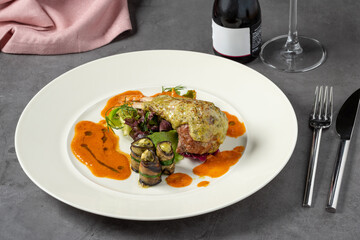 Lamb chops with various vegetables in a fine dining restaurant