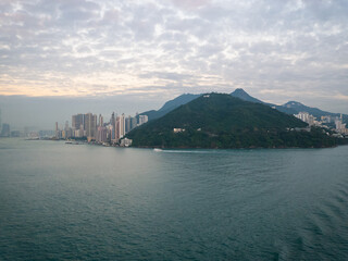 Naklejka premium View of Hong Kong Island living quarter cityscape with many skyscraper buildings from sea.