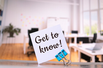 Get to know with a smile written on a memo at the office