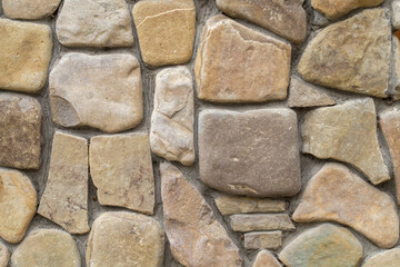 Natural rough stone fence as texture, pattern, background