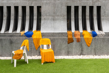 Drying clothes of Buddhist monks in a garden in front of a temple