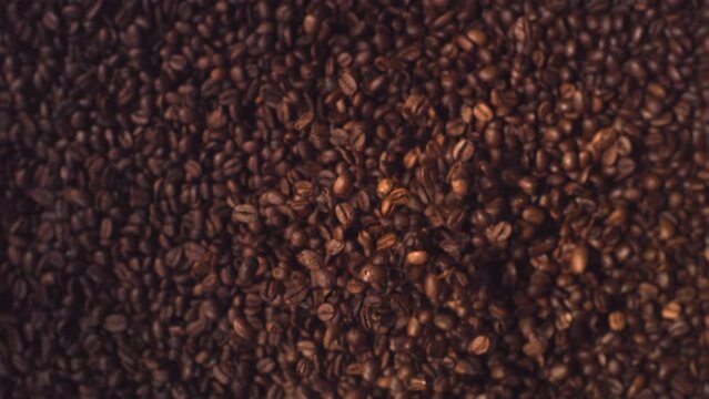 Coffee Beans Super Slow Motion Falling top down shot.
High Speed Coffee Beans flying