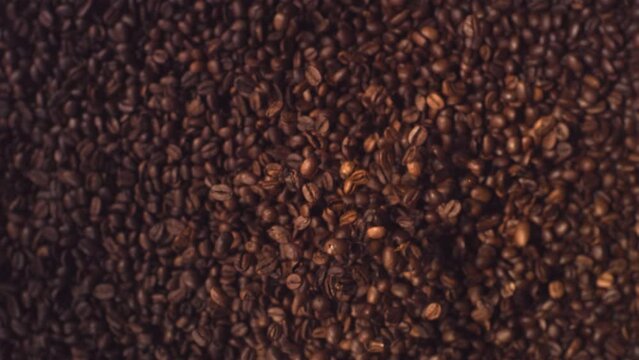 Coffee Beans Super Slow Motion Falling top down shot.
High Speed Coffee Beans flying