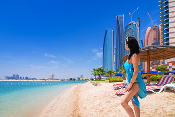 Beautiful woman on a hot UAE beach in Abu Dhabi.