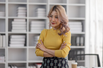Young women asian confidence team leader business looking camera and smile in modern office room with blurred background group people