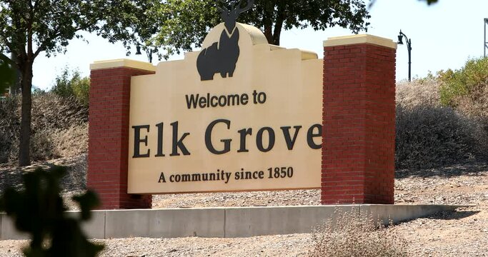 Elk Grove, California, USA - July 16, 2021: Afternoon sunlight shines on the freeway welcome sign of Elk Grove.