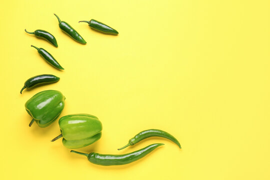 Composition with peppers on yellow background