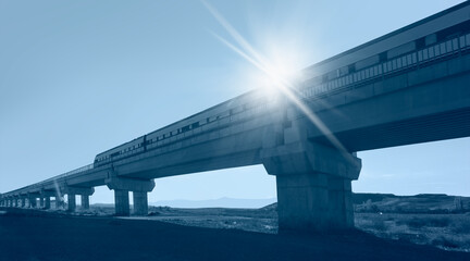 High-speed train crossing a viaduct
