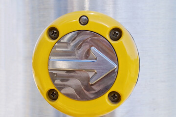 metal arrow push button in right direction with bright yellow plastic 