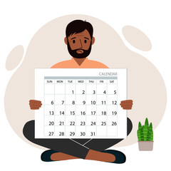 A man sits cross-legged and holds a large calendar glider in his hands. Concept of planning, make plans, schedule, event.