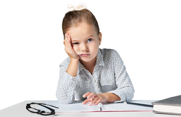 Bored girlt with hands on face sitting at desk