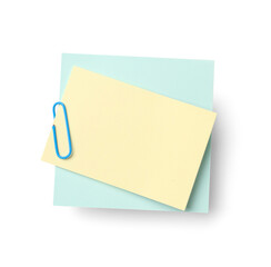 Yellow and blue sticky notes with paper clip on white background