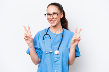 Young caucasian surgeon doctor woman isolated on white background showing victory sign with both hands