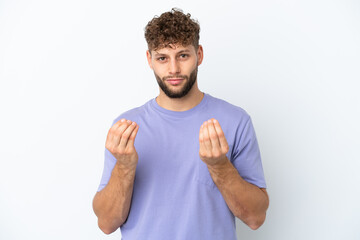 Naklejka premium Young handsome caucasian man isolated on white background making money gesture but is ruined