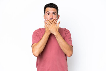 Young handsome man over isolated white background covering mouth with hands