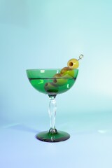 Elegant Art Deco Dirty Martini with Olives in a Vintage Green Glass