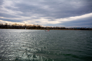 Windsurfing on a lake in the middle of the city of Krakow, Poland.