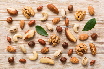 Composition of nuts , flat lay - mix hazelnuts, cashews, almonds on table background. healthy eating concepts and food background