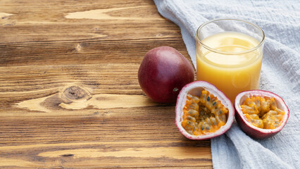 Fresh passion fruit juice on a wooden table.