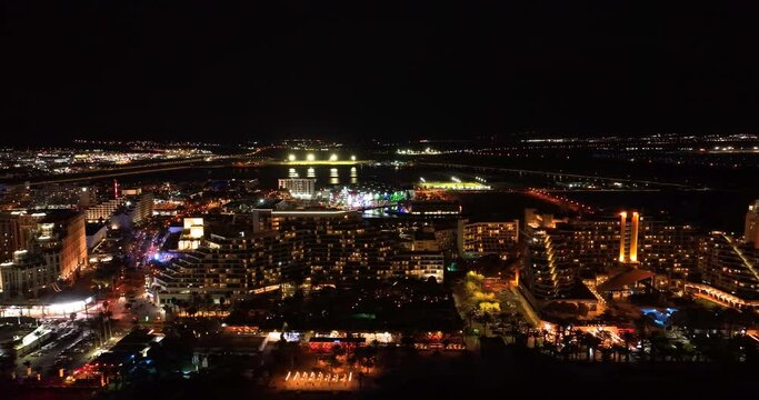 Aerial footage of the promenade in Eilat with the beautiful hotels in the evening. Shot in C4K Apple ProRes 422 HQ