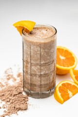 Milkshake with orange in white background