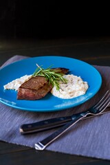 Steak and Mashed Potatoes meal in a blue plate