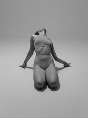 Black and white photo of body parts. Geometry and yoga poses of a naked female body 