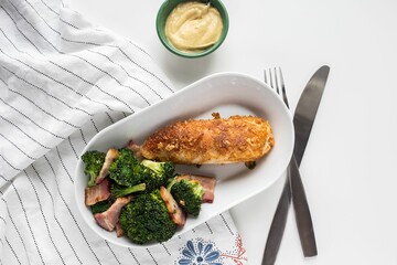 High angle closeup of a chicken breast and broccoli meal