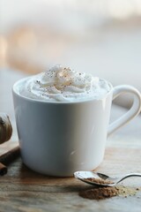 Vertical shot of a cup of hot chocolate on the wooden background