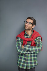 Fototapeta premium Stylish young man posing in the studio on gray background