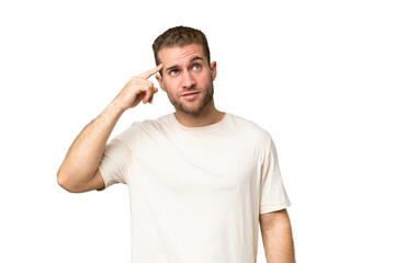 Young handsome caucasian man isolated on green chroma background making the gesture of madness...