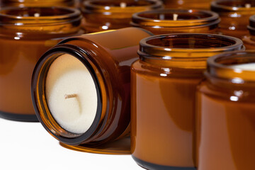 A set of different aroma Soy and coconut wax candles in brown glass jars. Scented calming candle....