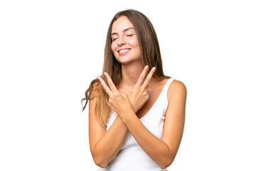 Fototapeta premium Young pretty woman over isolated background smiling and showing victory sign