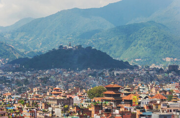 Fototapeta na wymiar View of the city from above. Red roofs, stupas. Kathmandu. Nepal