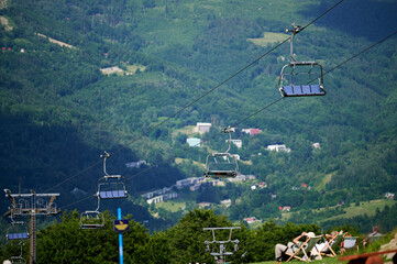 bottom view of the cable car carriages and the sky in the Polish mountains