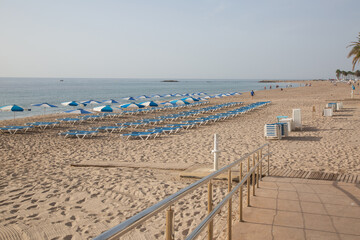 Sun Loungers set out on Beach, Villajoyosa, Alicante; Spain