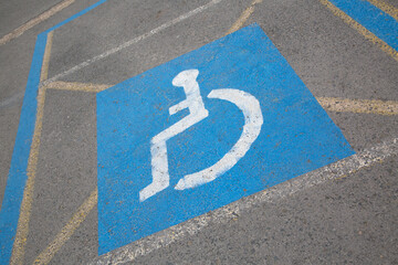 Closeup of Blue Disabled Parking Space Sign on Slant