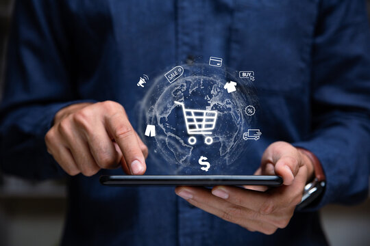 Hand of businessman showing shopping cart icon on tablet,  Online shopping and e-commerce concept.