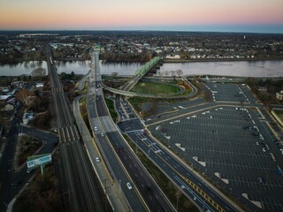 Fototapeta na wymiar Aerial of the cityscape of Trenton, New Jersey, cars driving along the highways at sunrise