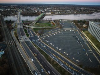 Aerial of the cityscape of Trenton, New Jersey, cars driving along the highways at sunrise