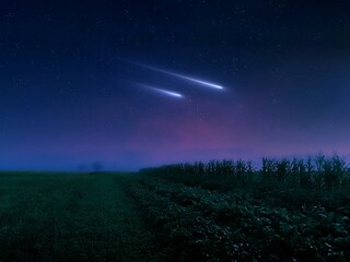 Naklejka na ściany i meble Falling meteorites. Two meteors in the night sky over green fields. Dreamlike night landscape with stars and comets.