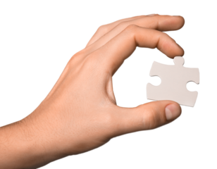 Hand Holding a Puzzle Piece