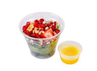 Salad with microgreens, strawberries, pine nuts and pomegranate seeds. Isolated, on a white background. Side view