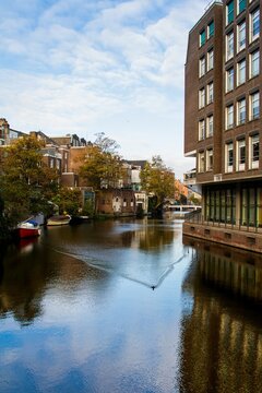 Vertical Of Nieuwe Herengracht Canal Buildings And Trees Around, Netherlands