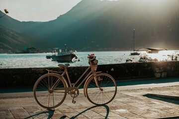 Beautiful bicycle decorated with flowers against the Kotor Bay seaside