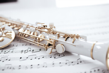 Obraz premium Illustration of a clarinet in notes and white background, generative ai