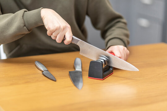 Premium Photo  Grindstone close-up. electric knife sharpening