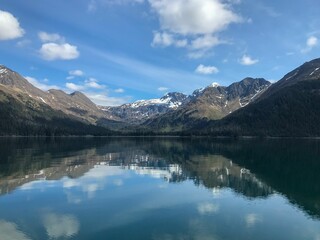 Fototapeta na wymiar Snowy mountains reflected on the lake, Homer, Alaska
