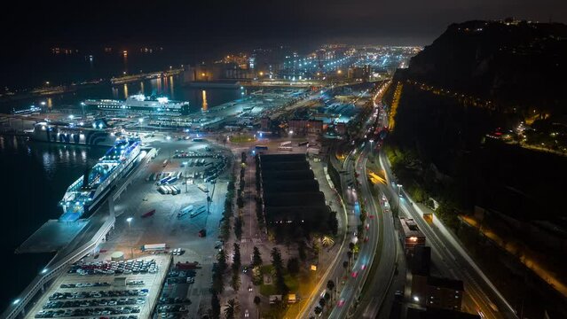 night illumination barcelona city parking bay dock traffic road aerial panorama 4k timelapse spain